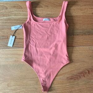New with Tags Babaton contour body suit in coral size Small